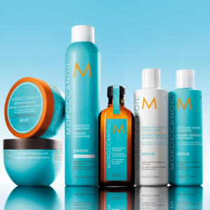 Moroccan Oil Products lined up with blue gradient background